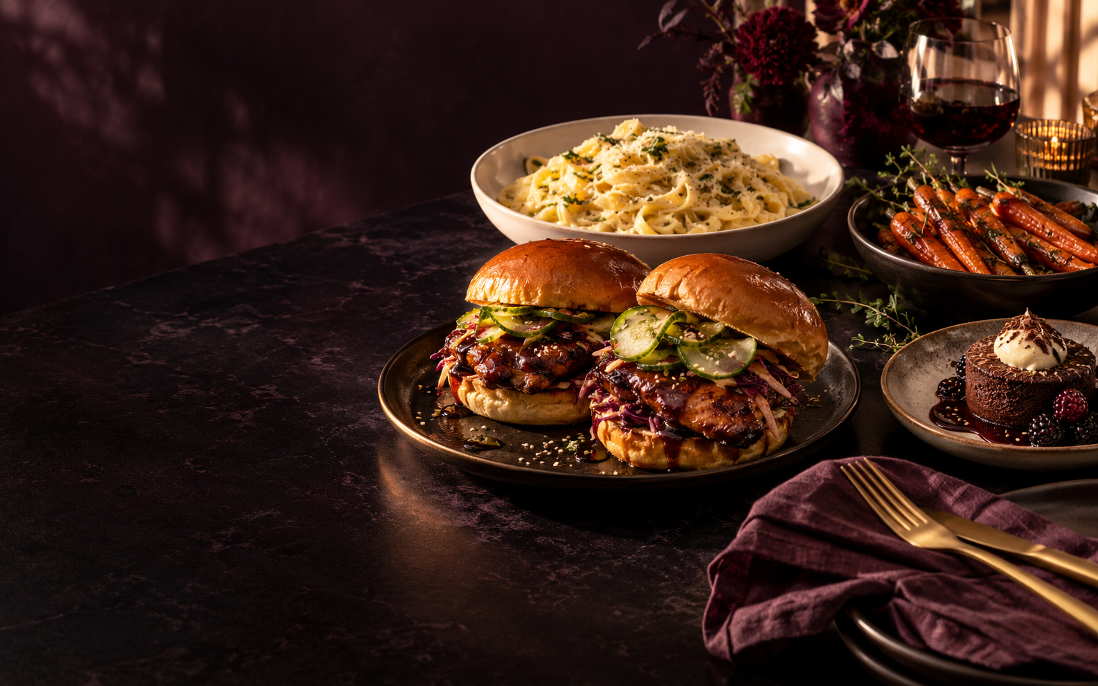 A restaurant-worthy spread of chicken sandwiches, creamy pasta, roasted carrots, and chocolate dessert