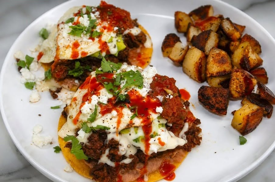 Huevos rancheros with chorizo and crispy breakfast potatoes