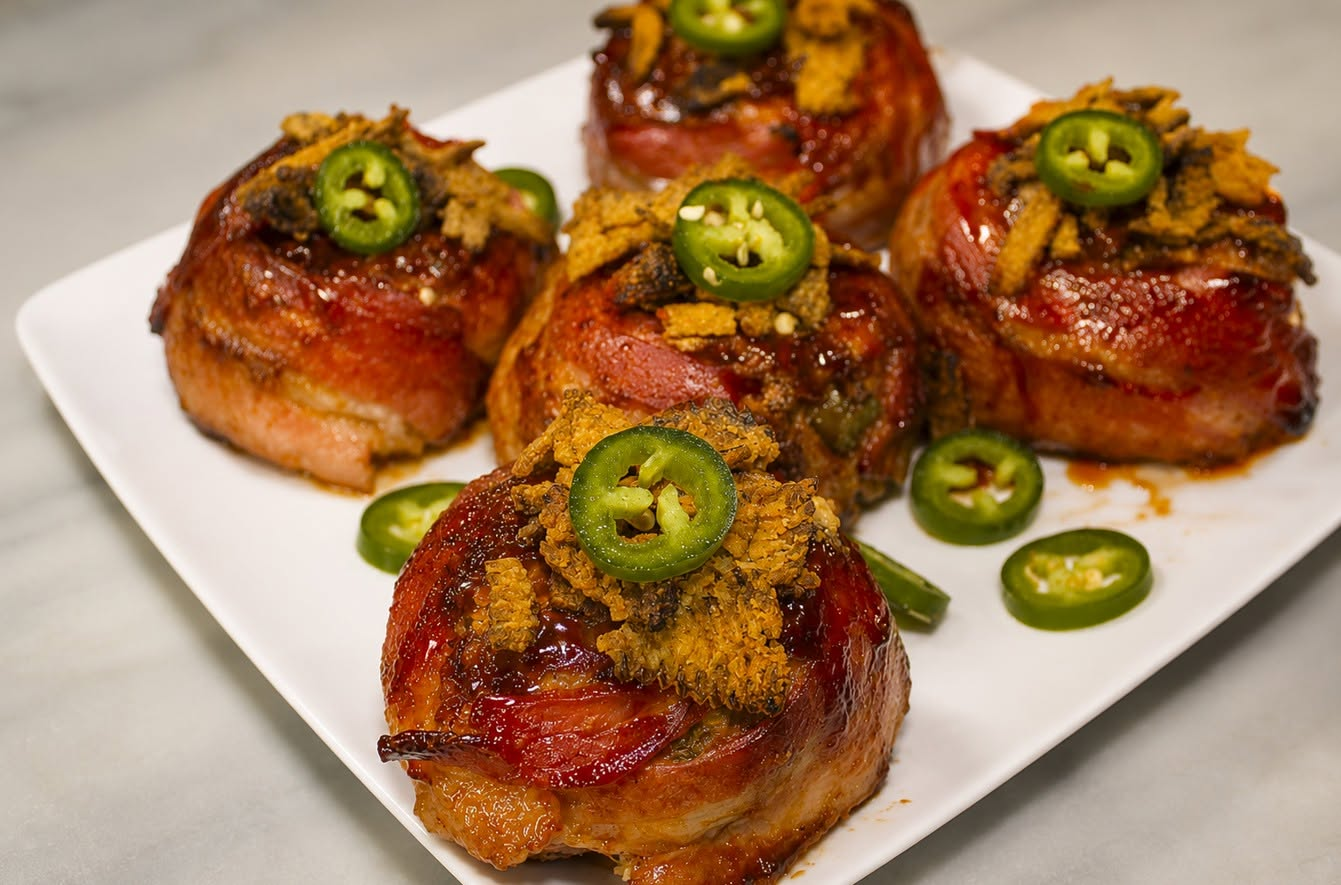Bacon-wrapped jalapeño popper mini meatloaves with a glossy barbecue glaze